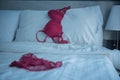 Red women underware on white bed Royalty Free Stock Photo