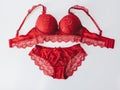 Red women underwear with lace isolated on white background. red bra and pantie.Copy space. Royalty Free Stock Photo