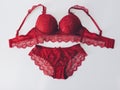 Red women underwear with lace isolated on white background. red bra and pantie.Copy space. Royalty Free Stock Photo