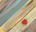 A red heart on a diagonal wood plank background Royalty Free Stock Photo