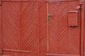 Red wood texture from planks in a closed gate Royalty Free Stock Photo