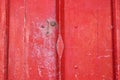 Red wooden antique door with small handle Royalty Free Stock Photo