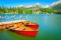 Red wooden boats on mountain lake in Slovakia Royalty Free Stock Photo