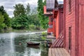 Red wooden buildings by a river Royalty Free Stock Photo