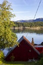 Red wooden cabin facing the sea Royalty Free Stock Photo