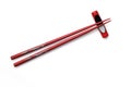Red wooden chopsticks and chopstick rest . Royalty Free Stock Photo