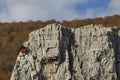 Red wooden climber house in the Lakatnik rocks and Alpine climber, Iskar river defile, Sofia province