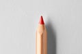 Red wooden crayon pencil on white background. Close up macro view Royalty Free Stock Photo