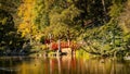 Red wooden crossing bridge over the water Royalty Free Stock Photo