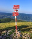 Red, wooden crossroads signpost on Dry mountain