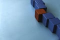 Red wooden cube among others. different, leadership, teamwork concept. Banner with copy space Royalty Free Stock Photo