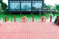 Red wooden deck platform outdoor wood floor backyard patio park terrace Royalty Free Stock Photo