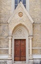 Red wooden door of catolic curch