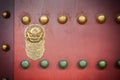 Red wooden door with golden lion figure at the Forbidden City, Beijing Royalty Free Stock Photo