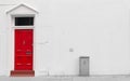 Red wooden door with silver mail door slot and door knocker Royalty Free Stock Photo