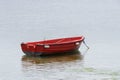 Red wooden fishing boat moored at the sea Royalty Free Stock Photo