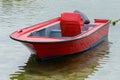 Red wooden fishing boat moored on the shore Royalty Free Stock Photo