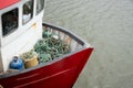Red wooden fishing boat and nets in the sea. Fishing industry Royalty Free Stock Photo