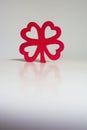 Red wooden four leaf clover Royalty Free Stock Photo