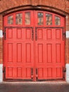 Red wooden gates of vintage fire station. Royalty Free Stock Photo