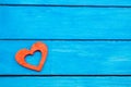 Red wooden heart on a blue background, Valentine`s Day. the concept of love. romance Royalty Free Stock Photo