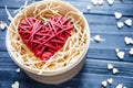 Red wooden heart lies in box on dark table with mini hearts around. St Valentines , Mothers day, romance concept Royalty Free Stock Photo