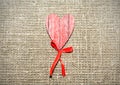 Red wooden heart over burlap Royalty Free Stock Photo