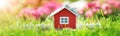 Red wooden house on the grass in garden Royalty Free Stock Photo