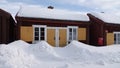 Swedish wooden red church house in Lovanger kyrkstad in winter in Sweden
