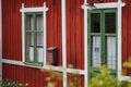 Red wooden house with white frames. Old house Royalty Free Stock Photo