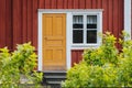 Red wooden house with white frames. Old house Royalty Free Stock Photo