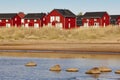 Red wooden houses near Marjaniemi beach, Hailuoto island. Finland. Royalty Free Stock Photo