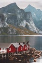 Red wooden houses rorbu in Norway mountains view Lofoten islands scandinavian landscape