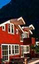 Red wooden huts in Norway on a polar night