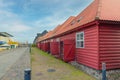 Red wooden houses with offices and shops on the island of neighbourhood Christianshavn near the Copenhagen opera house. Royalty Free Stock Photo