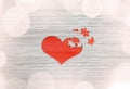 Red wooden puzzle heart on grey background Royalty Free Stock Photo