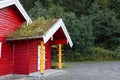 Red wooden scandinavian grass roof house in Norway Royalty Free Stock Photo