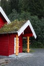 Red wooden scandinavian grass roof house in Norway Royalty Free Stock Photo