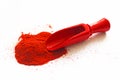 Red wooden scoop with paprika on white background Royalty Free Stock Photo