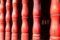 Red wooden sculpted pillars in the Temple of Literature Quoc Tu Giam, Hanoi, Vietnam
