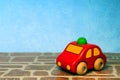 Red wooden toy car on colorful background Royalty Free Stock Photo