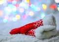 Red woolen mittens on a white background and bokeh. Royalty Free Stock Photo