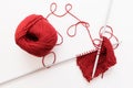 Red woolen thread and knitting needle isolated Royalty Free Stock Photo