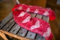 Red woollen socks on wooden chair