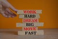 Red words Work hard dream big move fast on brick blocks on a beautiful orange background. Businessman hand. Business, motivational