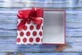 Red wrapped present box on vintage wooden board Royalty Free Stock Photo