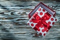 Red wrapped present box on vintage wooden board Royalty Free Stock Photo