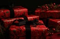 red wrapping paper with wrapping paper in front of christmas gifts Royalty Free Stock Photo