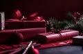 red wrapping paper with wrapping paper in front of christmas gifts Royalty Free Stock Photo