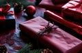 red wrapping paper with wrapping paper in front of christmas gifts Royalty Free Stock Photo